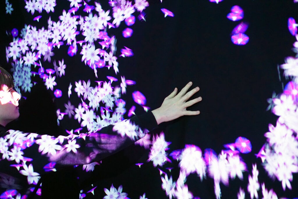 Digital art flowers on a wall that move if you touch them